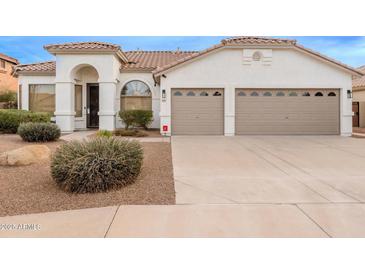 Single-story home with two-car garage and desert landscaping at 747 E Nolan Pl, Chandler, AZ 85249