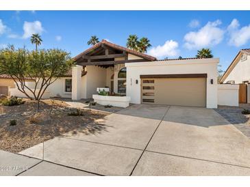 Stunning single-story home with updated landscaping and a modern facade at 9915 E Cinnabar Ave, Scottsdale, AZ 85258