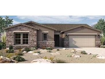 Single-story home with stone accents and a two-car garage at 32470 N 134Th Ln, Peoria, AZ 85383