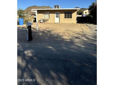 Ranch style home with front yard and driveway at 10025 N 13Th Pl, Phoenix, AZ 85020