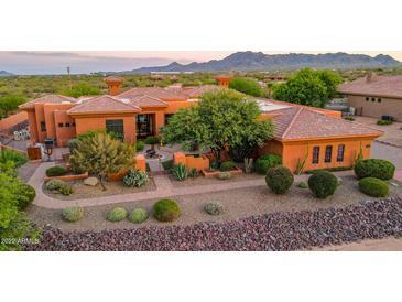 Aerial view of a luxurious home with a pool and landscaped grounds at 14521 E Desert Vista Trl, Scottsdale, AZ 85262