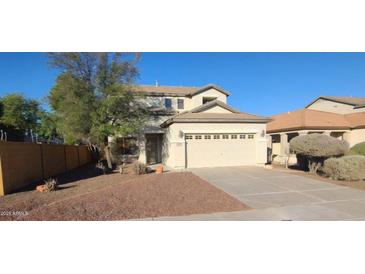 Two-story house with a garage and landscaped yard at 20356 N 261St Dr, Buckeye, AZ 85396