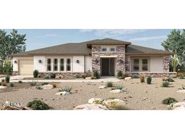 One-story home with stone accents and desert landscaping at 20787 W San Miguel Ave, Buckeye, AZ 85396