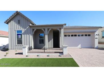 Charming single-Gathering home with a welcoming front porch and a two-car garage at 21537 W Pierson St, Buckeye, AZ 85396