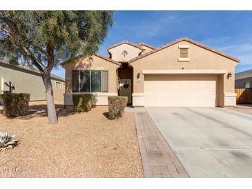 Single-story house with a two-car garage and well-maintained landscaping at 23802 W Tamarisk Ave, Buckeye, AZ 85326