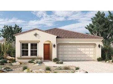 Single-story home with Spanish-style tile roof and desert landscaping at 26096 S 228Th Pl, Queen Creek, AZ 85142