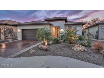 Single-story home with desert landscaping and a two-car garage at 29308 N 132Nd Ln, Peoria, AZ 85383