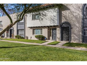 Updated 2-story townhome with front yard, walkway, and modern entry at 2968 E Clarendon Ave, Phoenix, AZ 85016