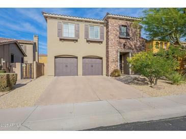 Two-story home with stone accents and a two-car garage at 3982 E Sandpiper Dr, Phoenix, AZ 85050