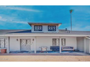 White two-story house with a covered porch and a large front yard at 4344 E Desert Crest Dr, Paradise Valley, AZ 85253