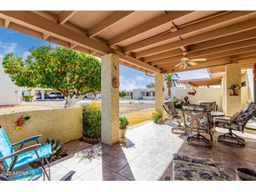 Covered patio with seating area and view of community at 7911 E Desert Trl, Mesa, AZ 85208