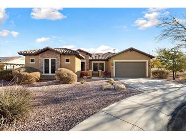 Single-story home with a two-car garage and desert landscaping at 20089 N 263Rd Dr, Buckeye, AZ 85396