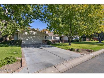 Ranch style home with large yard and mature trees at 210 W Palmaire Ave, Phoenix, AZ 85021