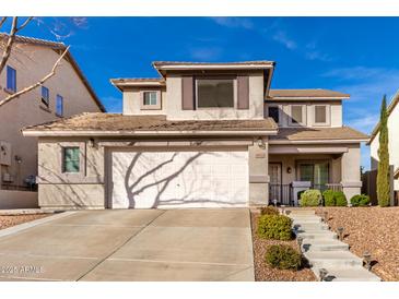 Two-story house with a large driveway and landscaped front yard at 6512 W Eagle Talon Trl, Phoenix, AZ 85083