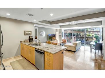 Modern kitchen with granite countertops and stainless steel appliances at 7131 E Rancho Vista Dr # 3002, Scottsdale, AZ 85251