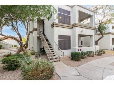 Exterior view of condo building with stairs and landscaping at 11375 E Sahuaro Dr # 2066, Scottsdale, AZ 85259