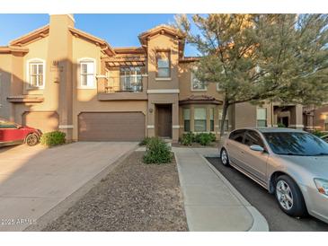 Two-story townhome with attached garage and balcony at 14250 W Wigwam Blvd # 2121, Litchfield Park, AZ 85340