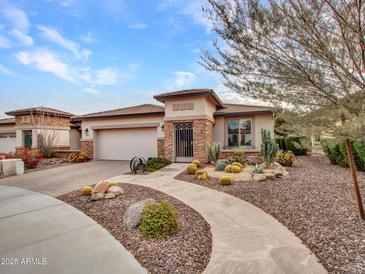 Single-story home with desert landscaping and a two-car garage at 16833 S 177Th Ln, Goodyear, AZ 85338