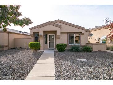 Single-story home with neutral exterior, landscaping, and walkway at 18619 N 136Th Dr, Sun City West, AZ 85375