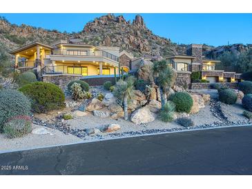 Stunning two-story home with stone accents and mountain views at 26905 N 98Th Way, Scottsdale, AZ 85262