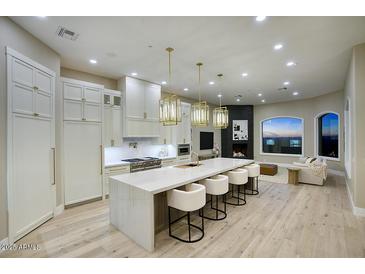 Gourmet kitchen featuring modern appliances and expansive island at 26905 N 98Th Way, Scottsdale, AZ 85262