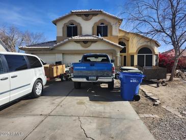 Two-story house with a driveway and landscaping at 8501 W Vernon Ave, Phoenix, AZ 85037