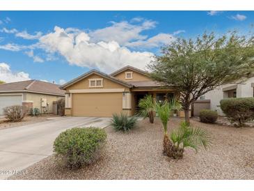 Single-story home with desert landscaping and a two-car garage at 851 E Bradstock Way, San Tan Valley, AZ 85140