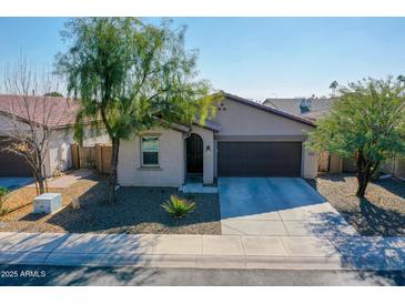 One-story home with a two-car garage and desert landscaping at 8539 W Lamar Rd, Glendale, AZ 85305