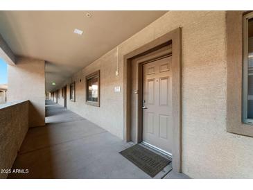 Inviting hallway with access to condo unit and features neutral wall tones at 920 E Devonshire Ave # 4005, Phoenix, AZ 85014