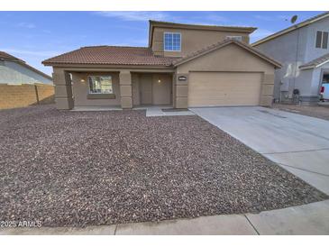 Two-story house with a brown exterior, a two-car garage, and a rock landscaping at 12517 W Rosewood Dr, El Mirage, AZ 85335