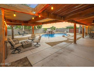 Inviting backyard oasis featuring a sparkling pool and relaxing patio at 37213 N 17Th Ave, Phoenix, AZ 85086