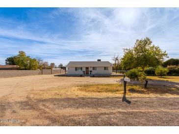 Single story home with a large yard at 521 E Lehi Rd, Mesa, AZ 85203