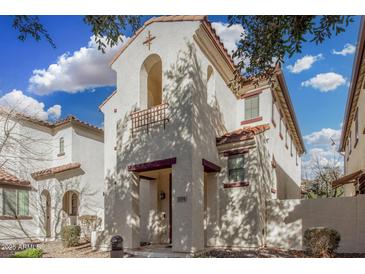 Charming two-story townhome with a red-tiled roof and a well-maintained stucco exterior at 5374 W Chisum Trl, Phoenix, AZ 85083
