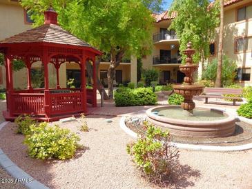 Relaxing courtyard with gazebo, fountain, and lush landscaping at 10330 W Thunderbird Blvd # A125, Sun City, AZ 85351