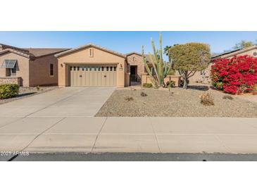Single-story home with desert landscaping and two-car garage at 12750 W Jasmine Trl, Peoria, AZ 85383