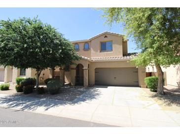 Two-story house with a two-car garage and landscaped front yard at 3254 E Sports Dr, Gilbert, AZ 85298