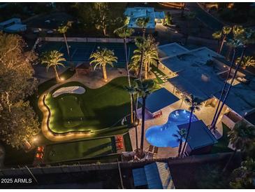 Luxury home with pool, putting green, and tennis court at 6127 E Mescal St, Scottsdale, AZ 85254