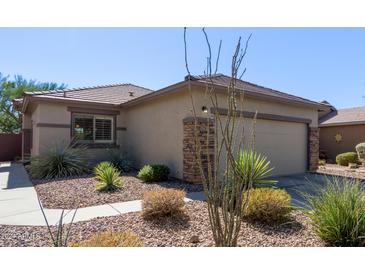 Single-story home with desert landscaping and two-car garage at 1713 W Morse Dr, Anthem, AZ 85086