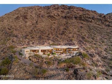 Luxury home nestled on mountainside with stunning views and a private driveway at 5526 E Roadrunner Rd, Paradise Valley, AZ 85253