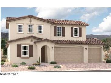 Two-story house with brown roof and shutters, attached three-car garage at 12362 W Marguerite Ave, Avondale, AZ 85323
