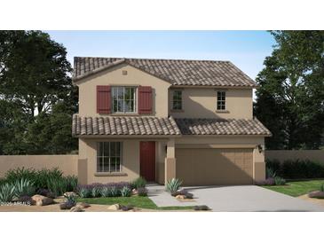 Two-story house with red door, tile roof, and landscaping at 22831 N 183Rd Dr, Surprise, AZ 85387