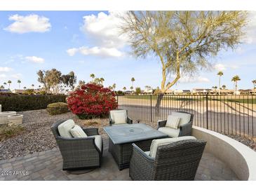 Patio with fire pit and comfortable seating area at 3171 N 159Th Ave, Goodyear, AZ 85395