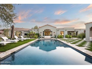 Luxury backyard oasis with a large inviting pool and spacious patio at 9290 E Thompson Peak Pkwy # 422, Scottsdale, AZ 85255
