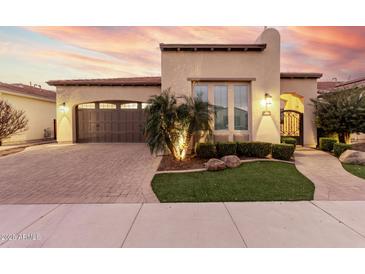 Beautiful single-story home with a landscaped front yard and a two-car garage at 1175 E Copper Holw, Queen Creek, AZ 85140