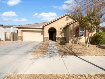 One-story home with a two-car garage and landscaped front yard at 22794 E Via Las Brisas --, Queen Creek, AZ 85142