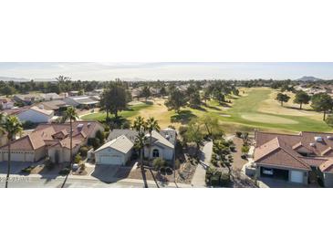 Aerial view of single-story home with golf course views at 563 W Champagne Dr, Chandler, AZ 85248