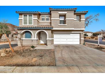 Charming two-story home with well-maintained landscaping and a two-car garage at 2626 S Southwind Dr, Gilbert, AZ 85295