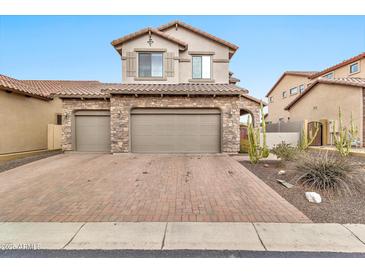 Two-story home with stone accents and a two-car garage at 8334 E Inca St, Mesa, AZ 85207