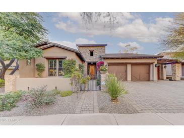 Stunning Spanish-style home with attractive landscaping and a gated entry at 17918 N 95Th St, Scottsdale, AZ 85255