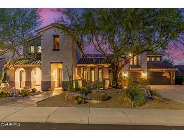 Two-story house exterior at dusk, showcasing landscaping and a large driveway at 2213 W Twain Dr, Anthem, AZ 85086